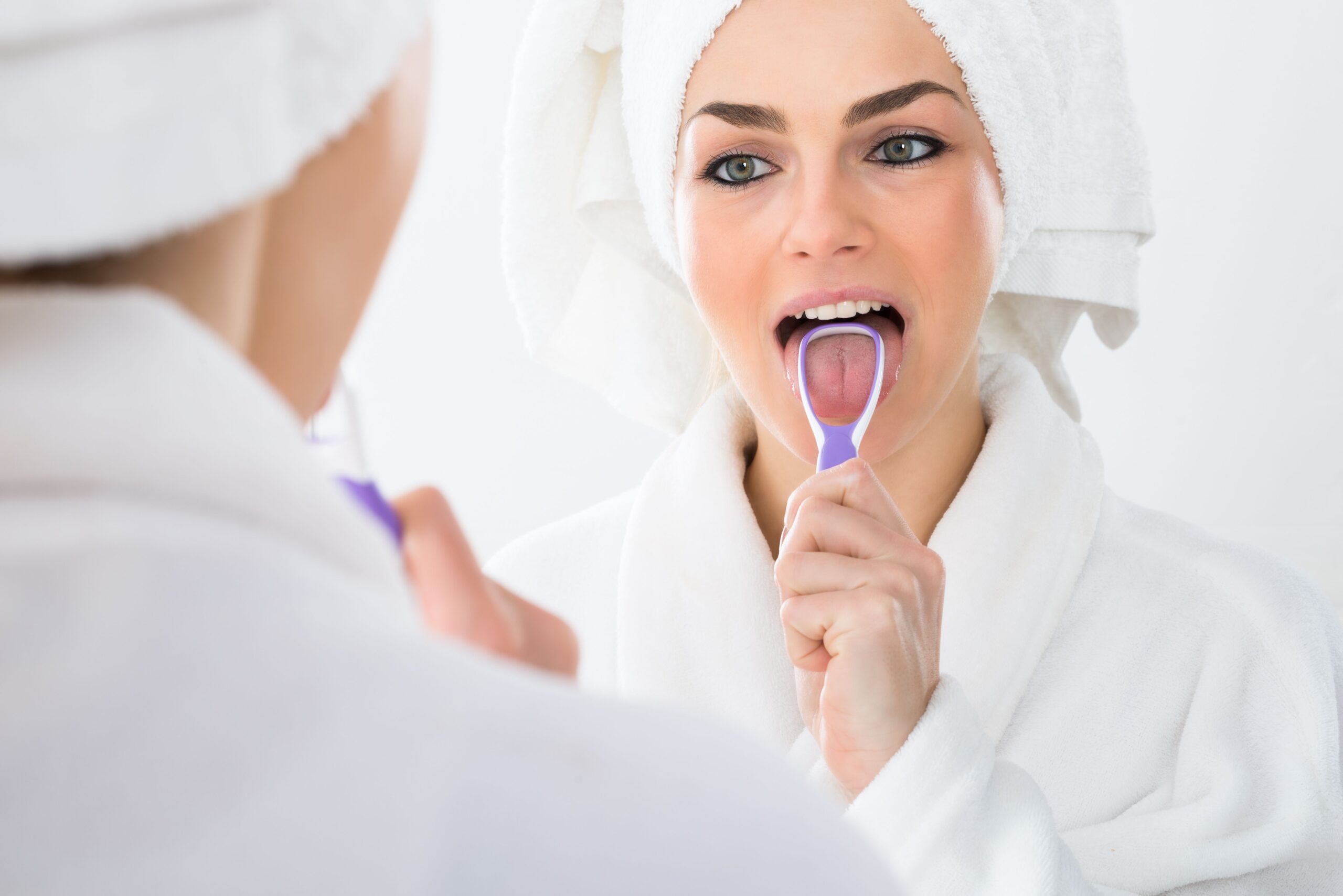 Houston Dentist | Should I Be Using a Tongue Scraper?